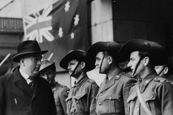 Australian prime minister Robert Menzies inspecting the Australian Guard of Honour, during a visit to the Ministry of Information, London, in February 1941. 
