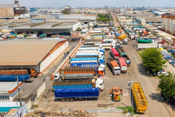 Trucks used for cocoa transportation outside a processing plant in Abidjan, Ivory Coast. The country is the world’s biggest cocoa producer.