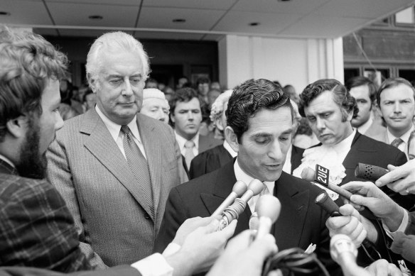 Gough Whitlam looks on quizzically in 1975 as the Governor-General’s Official Secretary, David Smith, announces that Sir John Kerr has dismissed the Whitlam government and installed Malcolm Fraser as caretaker prime minister. 