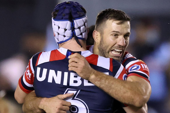 James Tedesco and Luke Keary embrace after winning their against the Sharks.