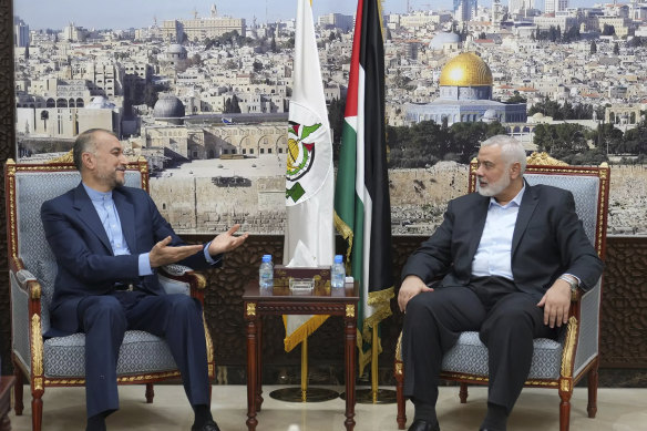 Iran’s Foreign Minister Hossein Amirabdollahian, left, speaks with Hamas chief Ismail Haniyeh in Doha, Qatar, on October 31.