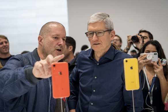 Former Apple chief designer Jony Ive (left) with Apple CEO Tim Cook. He is now teaming up with Ferrari to create an electric car.