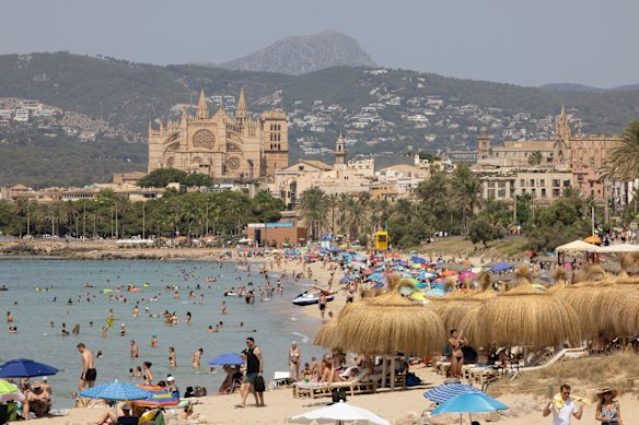 The Cathedral of Santa Maria of Palma, overlooking the beach in Palma de Mallorca.
