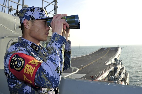 A Chinese sailor aboard a warship in the East China Sea.