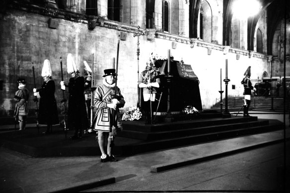 The coffin of King George VI resting on a catafalque in Westminster Hall in 1952.