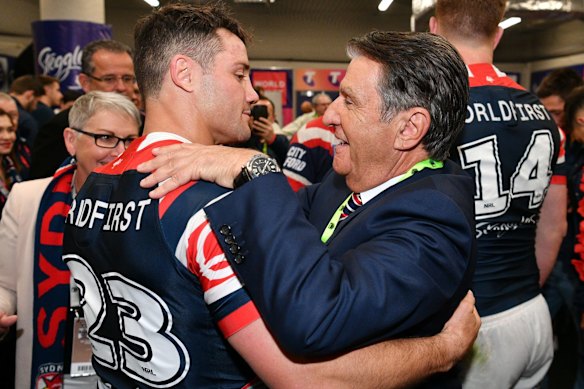 Nick Politis celebrates the Roosters’ 2018 grand final win with Cooper Cronk.