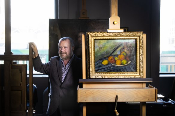 NGV curator Dr Ted Gott (with Cezanne’s <i>Fruit and a jug on a table</i>) says Schenck’s painting is one you can’t stop looking at.