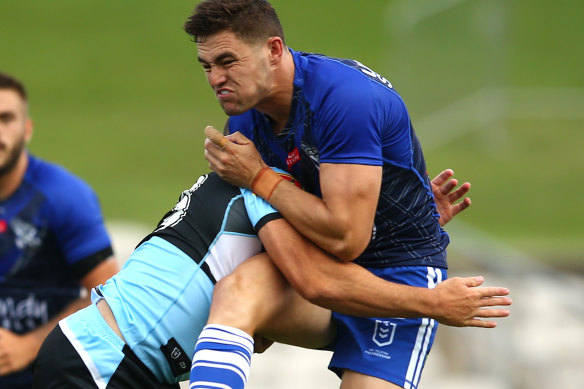 Kyle Flanagan cops a big hit during the Bulldogs’ trial match against Cronulla on Saturday. 