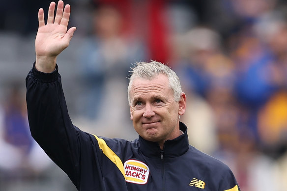 The former senior coach of the Eagles acknowledges supporters on Sunday.