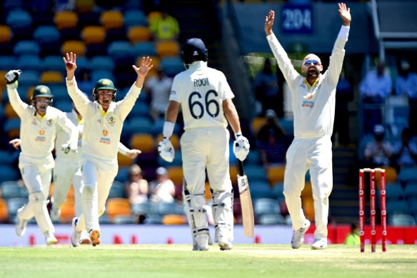 Nathan Lyon celebrates his 400th Test wicket after dismissing Dawid Malan.