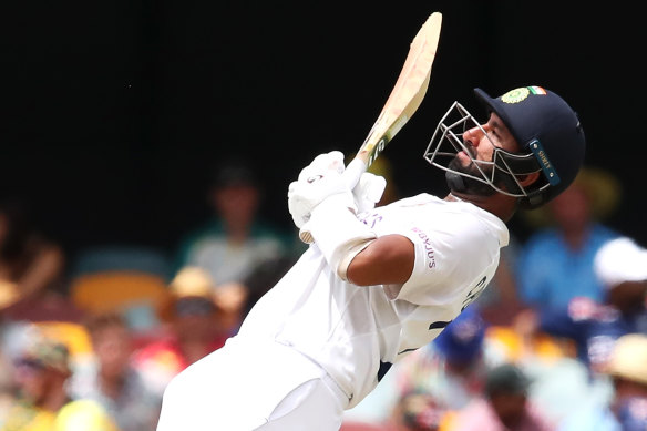 Cheteshwar Pujara bats on day three of the fourth Test at the Gabba. 