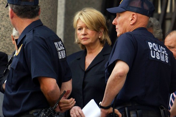 Martha Stewart flanked by US Marshals after her 2004 conviction for conspiracy, obstruction and two counts of lying to federal investigators. She maintains her innocence.