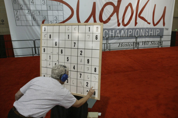 A competitor works on his Sudoku puzzle during a national championship in Philadelphia, US. 