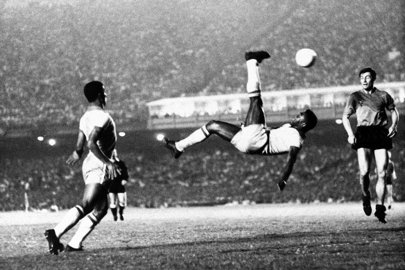 On his bicycle: Brazil’s soccer star Pele kicks the ball over his head during a game in 1968, location unknown.