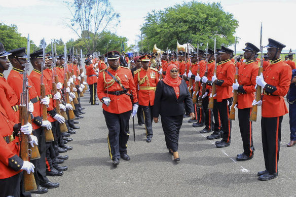 Samia Suluhu Hassan inspects the guard of honour after being sworn in.