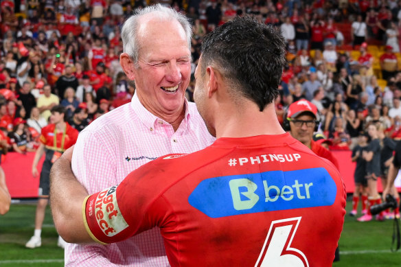 Wayne Bennett and Sean O’Sullivan celebrate the Dolphins’ big win against the Broncos.