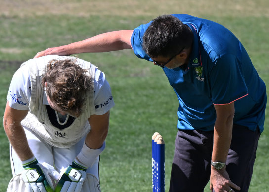 Will Pucovski is attended by medical staff after being struck on the helmet playing for Victoria last March.