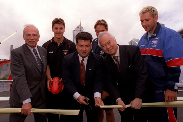 Wellington Lee at the ribbon cutting for the the opening of the Bourke Street pedestrian bridge with Eric Mayer (chairman of Docklands Authority), Major Projects Minister John Pandazopoulos, and footballers Mathew Lloyd, Clint Bizzell and Paul Hudson.