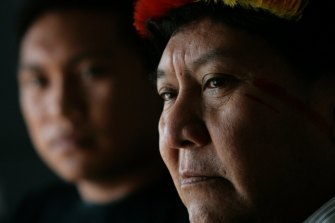 Kopenawa Yanomami, right, with his son Dario.