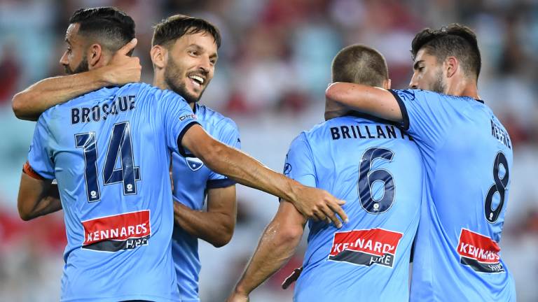 Back in the hunt: Alex Brosque celebrates with teammates after levelling the scores. 