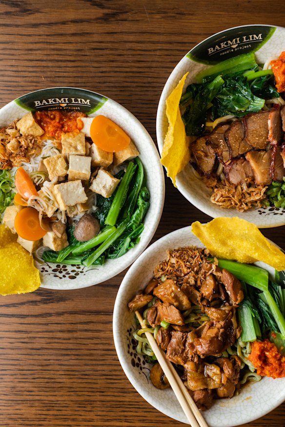 Noodle dishes are topped with your choice of pork, chicken or tofu, plus other toppings like braised greens and wonton skin.