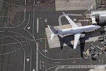 A Virgin Australia plane at Sydney Airport. International travellers miss out of lounge access even if they are frequent fliers.
