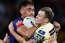 Jacob Laban of the Warriors collides with Billy Walters of the Broncos.
