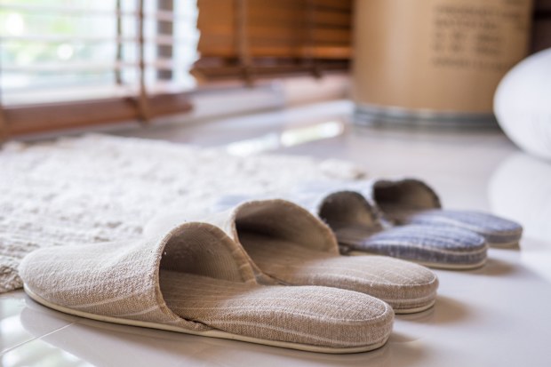 Pairs of slippers by the door to wear inside instead of shoes