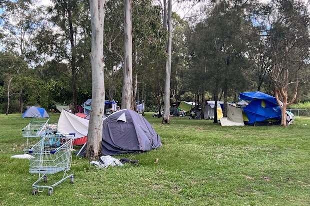 Brisbane - Apr 13 2024:Australians homeless tents in local park.Over 122,494 people were estimated to be experiencing homelessness in Australia on Census night in 2021.