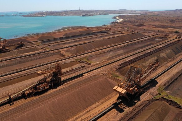 Iron ore stockpiles waiting to be transported at Rio Tinto’s port facility in Dampier. Rio and iron ore rival BHP will team up with BlueScope steel on the quest to create a ‘green’ steel’ industry in Australia.