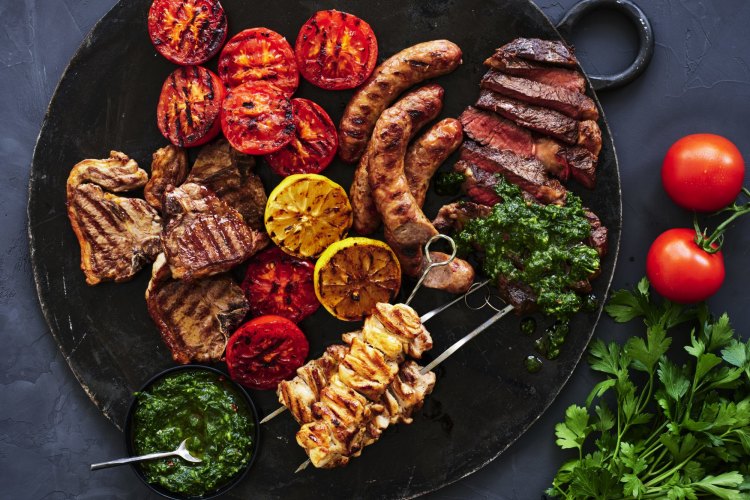 Adam Liaw’s mixed grill with salsa verde and roasted tomatoes.