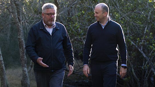 NSW Energy and Environment Minister, Matt Kean (right), with Deon van Rensburg, Director, Greater Sydney Branch of the National Parks and Wildlife Service, in Bobbin Head, Ku-Ring-Gai National Park earlier this month. 
