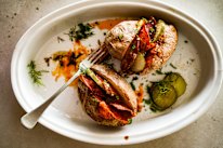 Katrina Meyink’s baked potato with Bloody Mary butter, pickles and bacon.