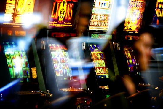 POKIES 080411 AFR PIC JOSH ROBENSTONE AFR FIRST USE ONLY GERNERIC POKIES POKER MACHINES GAMBLING TATTS TAB CORP GAMBLER PIC JOSH ROBENSTONE SPECIALX 82894