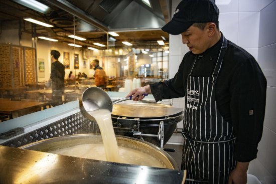 Head chef Sungjun Kim preparing bone broth at Hansang in Strathfield.