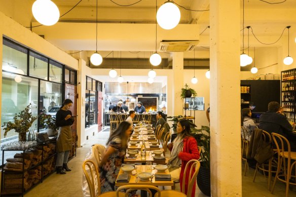 Serai’s dining room is industrial and energetic.