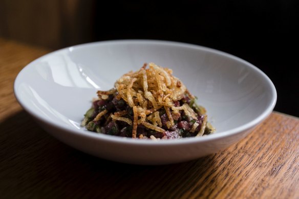 Kangaroo tartare, pickled cukes, tomato, potato served at Arthur.