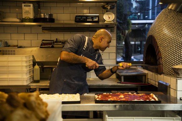 Marta owner-chef Flavio Carnevale baking in his kitchen, in the early hours of the morning.