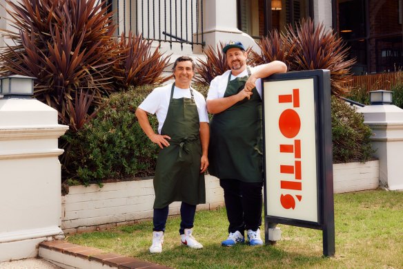 Merivale executive chef Mike Eggert  (left) with Lorne Hotel executive chef Matt Germanchis in front of the Totti’s sign.