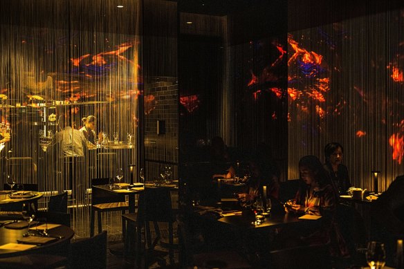 Dinner and a (light) show: projections inside the Ele dining room.