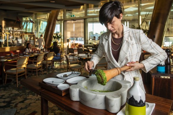 Restaurant manager Alice Perini preparing the pesto table-side at a’Mare.

