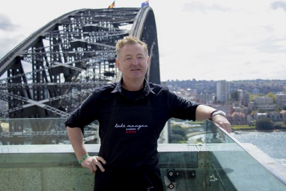 Chef Luke Mangan on a pylon on the Sydney Harbour Bridge.