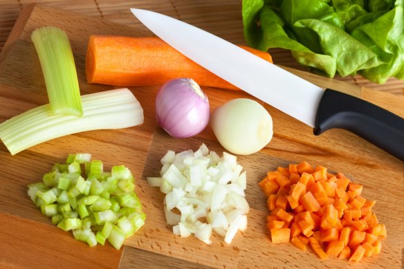 Chop the celery, carrots and onions into similar-sizes pieces for soffritto.