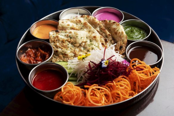 A papadam and naan platter served with zippy chutneys at Don’t Tell Aunty.