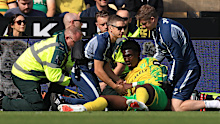 Mo Toure receives medical attention.