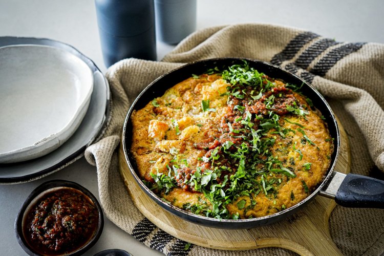 Potato gem and three-cheese frittata with spicy tomato salsa. Katrina Meynink's frittata recipes for Good Food May 2021. Please credit Katrina Meynink. Good Food use only.