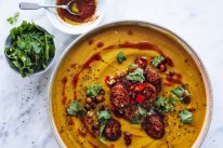 Jill Dupleix’s roast pumpkin soup with chickpeas, sausage and rose harissa.