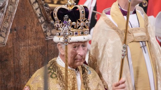 King Charles III holds the Sovereign’s Sceptre with Cross after he was crowned with St Edward’s Crown during the coronation ceremony at Westminster Abbey in London on Saturday.