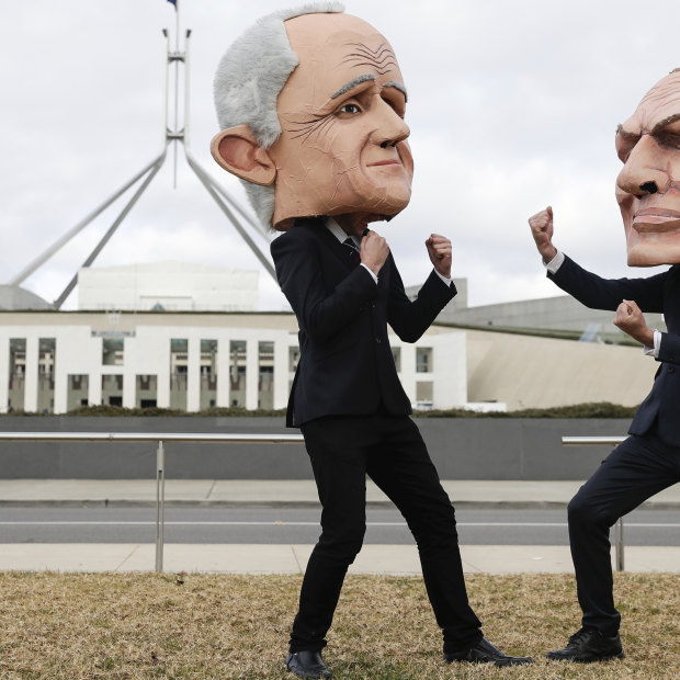 Puppets of Malcolm Turnbull and Tony Abbott during an event organised by left-wing activist group GetUp! on the lawn of Parliament House.