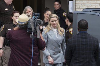 Actress Amber Heard leaves the Fairfax County Courthouse on Friday.